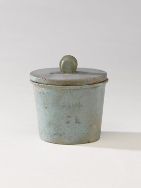  <em>One of a Set of Jars for Seven Sacred Oils or Unguents</em>, 305–30 B.C.E. Faience, 2 1/2 x 2 3/8 in. (6.4 x 6 cm). Brooklyn Museum, Charles Edwin Wilbour Fund, 49.52.6a-b. Creative Commons-BY (Photo: Brooklyn Museum, 49.52.6a-b_PS9.jpg)