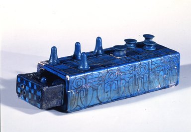  <em>Gaming Board Inscribed for Amenhotep III with Separate Sliding Drawer</em>, ca. 1390-1353 B.C.E. Faience, 2 3/16 x 3 1/16 x 8 1/4 in. (5.5 x 7.7 x 21 cm). Brooklyn Museum, Charles Edwin Wilbour Fund, 49.56a-b. Creative Commons-BY (Photo: Brooklyn Museum, 49.56a-b_view2_SL4.jpg)