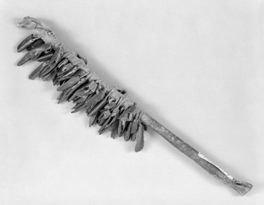 Sioux. <em>Warrior Society Dance Wand</em>, early 19th century. Hide, wood, deer hooves, 15 x 2 1/2 x 1/2 in. (38.1 x 6.4 x 1.3 cm). Brooklyn Museum, Henry L. Batterman Fund and the Frank Sherman Benson Fund, 50.67.117. Creative Commons-BY (Photo: Brooklyn Museum, 50.67.117_bw_SL1.jpg)