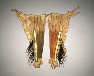 Sioux. <em>Pair of Leggings for Chief's War Dress</em>, early 19th century. Hide, porcupine quills, scalp locks, pony beads, maiden hair fern, horsehair, dye, B: 29 x 42 3/4 in. (73.7 x 108.6 cm). Brooklyn Museum, Henry L. Batterman Fund and Frank Sherman Benson Fund, 50.67.1b-c. Creative Commons-BY (Photo: Brooklyn Museum, 50.67.1b-c_SL1.jpg)