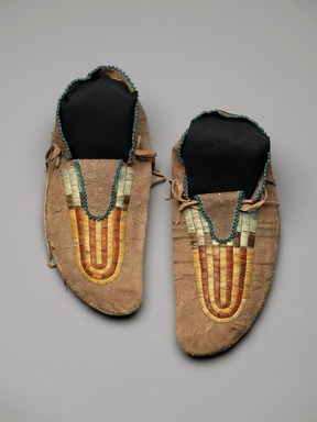 Sioux. <em>Pair of Moccasins</em>, early 19th century. Hide, beads, bird quills, porcupine quills, tin, deer hair, sinew, pigment, 4 x 5 x 11 in. (10.2 x 12.7 x 27.9 cm). Brooklyn Museum, Henry L. Batterman Fund and Frank Sherman Benson Fund, 50.67.23a-b. Creative Commons-BY (Photo: Brooklyn Museum, 50.67.23a-b_PS2.jpg)