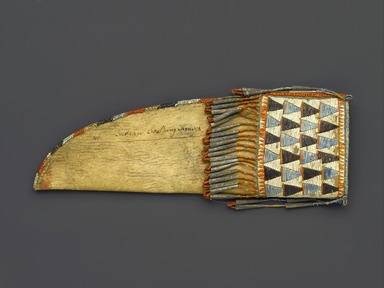 Eastern, Sioux. <em>Knife Sheath</em>, early 19th century. Rawhide, buckskin, porcupine quills, tin, sinew, thread, 9 1/2 x 3 1/4 in. (24.1 x 8.3 cm). Brooklyn Museum, Henry L. Batterman Fund and the Frank Sherman Benson Fund, 50.67.41. Creative Commons-BY (Photo: Brooklyn Museum, 50.67.41_PS1.jpg)