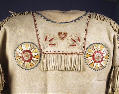 Red River Metis. <em>Chief's War Shirt</em>, 19th century. Buckskin, porcupine quills, garnet beads, pony beads, seed beads, thread
, 39 in. (99.1 cm). Brooklyn Museum, Henry L. Batterman Fund and Frank Sherman Benson Fund, 50.67.4. Creative Commons-BY (Photo: Brooklyn Museum, 50.67.4_front_SL4.jpg)