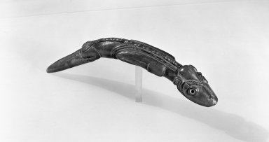 Rapanui. <em>Lizard Figure (Moko Miro)</em>, 19th century. Wood, shell or bone, 16 x 2 x 1 3/4 in. (40.6 x 5.1 x 4.4 cm). Brooklyn Museum, Museum Collection Fund, 50.78. Creative Commons-BY (Photo: Brooklyn Museum, 50.78_view1_acetate_bw.jpg)