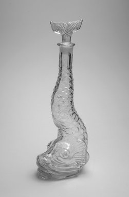  <em>Bottle, Fish</em>, late 19th century. Glass, 15 1/4 x 4 1/8 x 5 3/4 in. (38.7 x 10.5 x 14.6 cm). Brooklyn Museum, Gift of Alberta P. Locke, 52.110.4a-b. Creative Commons-BY (Photo: Brooklyn Museum, 52.110.4a-b_bw_Justin_van_Soest_photograph.jpg)