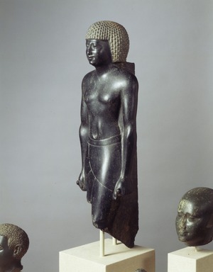  <em>Statue of a Priest of Amun</em>, 381–362 B.C.E. Diorite, 20 1/16 x 6 1/4 x 5 1/2 in., 30 lb. (51 x 15.9 x 14 cm, 13.61kg). Brooklyn Museum, Charles Edwin Wilbour Fund, 52.89. Creative Commons-BY (Photo: Brooklyn Museum, 52.89_view2_SL4.jpg)