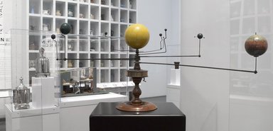  <em>Three Dimensional Celestial Instrument, So-Called Orrery</em>, 19th century. Wood, metal, pigment, component 'a' - the planets: 16 x 40 x 17 in. (40.6 x 101.6 x 43.2 cm). Brooklyn Museum, Brooklyn Museum Collection, 53.260a-b. Creative Commons-BY (Photo: Brooklyn Museum, 53.260a-b_overall_installation_PS4.jpg)