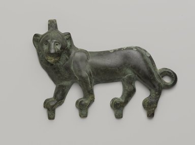  <em>Lion Applique</em>, 4th–3rd century B.C.E. Bronze, 4 3/16 x 7 3/8 in. (10.7 x 18.8 cm). Brooklyn Museum, Charles Edwin Wilbour Fund, 55.141. Creative Commons-BY (Photo: Brooklyn Museum, 55.141_PS9.jpg)