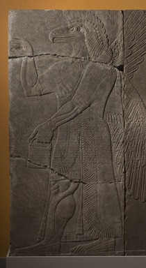 Assyrian. <em>Apkallu-figure</em>, ca. 883–859 B.C.E. Gypsum stone, pigment, 90 9/16 x 42 3/16 in. (230 x 107.2 cm). Brooklyn Museum, Purchased with funds given by Hagop Kevorkian and the Kevorkian Foundation, 55.149. Creative Commons-BY (Photo: Brooklyn Museum, 55.149_at_PS11.jpg)