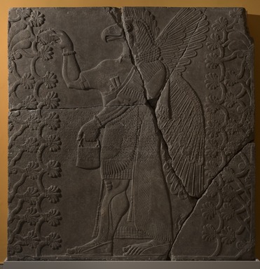 Assyrian. <em>Apkallu-figure Between Two Sacred Trees</em>, ca. 883–859 B.C.E. Gypsum stone, pigment, 84 13/16 x 83 1/8 in. (215.5 x 211.2 cm). Brooklyn Museum, Purchased with funds given by Hagop Kevorkian and the Kevorkian Foundation, 55.156. Creative Commons-BY (Photo: Brooklyn Museum, 55.156_at_PS11.jpg)