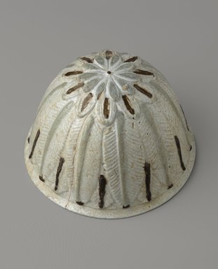  <em>Molded Hemispherical Bowl</em>, 2nd–1st century B.C.E. Faience, 3 11/16 x Diam. 5 1/2 in. (9.4 x 14 cm). Brooklyn Museum, Charles Edwin Wilbour Fund, 55.1. Creative Commons-BY (Photo: Brooklyn Museum, 55.1_PS9.jpg)