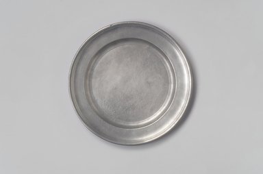 Edward Danforth (American). <em>Plate</em>, ca. 1790. Pewter, 5/8 x 8 x 8 in. (1.6 x 20.3 x 20.3 cm). Brooklyn Museum, Dick S. Ramsay Fund, 55.210. Creative Commons-BY (Photo: Brooklyn Museum, 55.210.jpg)