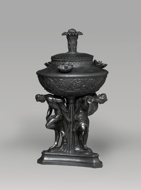 Wedgwood and Sons (British, Staffordshire, 1759–present). <em>Oil Lamp</em>, Circa 1790. Basalt (stoneware), 13 1/2 × 7 1/2 × 7 1/4 in. (34.3 × 19.1 × 18.4 cm). Brooklyn Museum, Gift of Emily Winthrop Miles, 55.25.3b. Creative Commons-BY (Photo: Brooklyn Museum, 55.25.3b_edited_PS2.jpg)