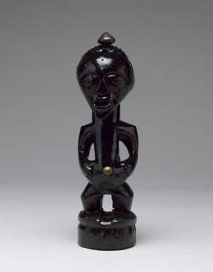 Songye. <em>Power Figure (Nkishi)</em>, late 19th or early 20th century. Wood, metal, organic materials, 8 1/2 x 2 1/4 in. (21.7 x 6.0 cm). Brooklyn Museum, Gift of Arturo and Paul Peralta-Ramos, 56.6.43. Creative Commons-BY (Photo: Brooklyn Museum, 56.6.43_front_PS6.jpg)