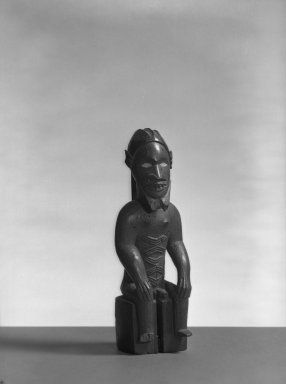 Beembe. <em>Seated Male Figure (Mukuya)</em>, 19th-20th century. Wood, ceramic, 7 1/4 x 2 1/2 x 2 in. (18.1 x 6.8 x 5.0 cm). Brooklyn Museum, Gift of Arturo and Paul Peralta-Ramos, 56.6.45. Creative Commons-BY (Photo: Brooklyn Museum, 56.6.45_acetate_bw.jpg)