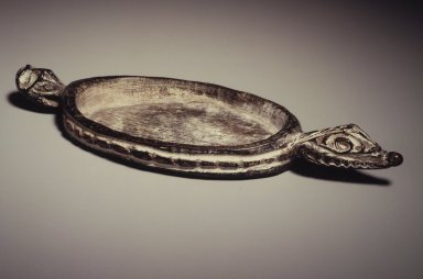 Iatmul. <em>Pigment Dish</em>, 20th century. Wood, pigment, 8 x 3 x 1 in. (20.3 x 7.6 x 2.5 cm). Brooklyn Museum, Gift of Arturo and Paul Peralta-Ramos, 56.6.48. Creative Commons-BY (Photo: Brooklyn Museum, 56.6.48.jpg)