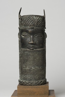 Edo. <em>Benin Head</em>, early 20th century. Copper alloy, 14 15/16 × 5 11/16 in. (38 × 14.5 cm). Brooklyn Museum, Gift of Arturo and Paul Peralta-Ramos, 56.6.66. Creative Commons-BY (Photo: Brooklyn Museum, 56.6.66_overall_PS11.jpg)