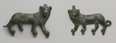  <em>Lion Applique</em>, 4th–3rd century B.C.E. Bronze, 5 5/8 x 8 1/8 in. (14.3 x 20.7 cm). Brooklyn Museum, Charles Edwin Wilbour Fund, 57.40. Creative Commons-BY (Photo: , 57.40_55.141_PS9.jpg)