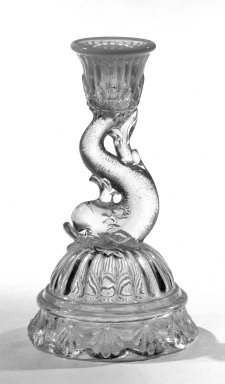  <em>Candleholder</em>, ca. 1870. Pressed glass, 6 3/4 x 1 7/8 in. (17.1 x 4.8 cm). Brooklyn Museum, Gift of Mrs. Cheever Porter, 57.90.44. Creative Commons-BY (Photo: Brooklyn Museum, 57.90.44_bw.jpg)