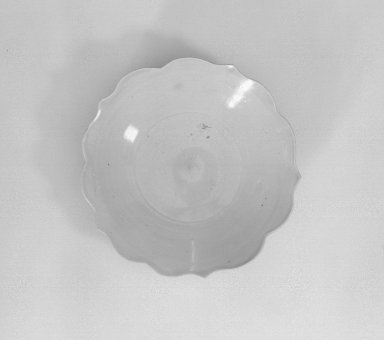  <em>Dish</em>, 907-960. Porcelain, 1 9/16 x 6 1/8 in. (4 x 15.5 cm). Brooklyn Museum, Gift of Frederic B. Pratt, by exchange, 57.93. Creative Commons-BY (Photo: Brooklyn Museum, 57.93_view1_acetate_bw.jpg)