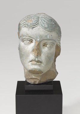  <em>Head of a Queen or Goddess</em>, probably 1st century B.C.E. Faience, 3 3/8 x 2 3/16 x 2 1/2 in. (8.6 x 5.5 x 6.3 cm). Brooklyn Museum, Charles Edwin Wilbour Fund, 58.1. Creative Commons-BY (Photo: Brooklyn Museum, 58.1_PS9.jpg)