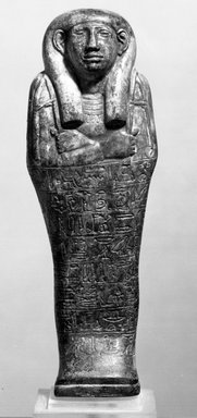 Egyptian. <em>Funerary Figurine of Petamenophis</em>, ca. 670-650 B.C.E. Steatite, glaze, Height: 6 7/16 in. (16.3 cm). Brooklyn Museum, Charles Edwin Wilbour Fund, 60.10. Creative Commons-BY (Photo: Brooklyn Museum, 60.10_NegA_bw_SL4.jpg)