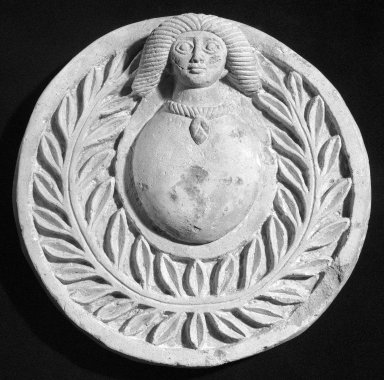  <em>Roundel with Human Head</em>, 20th century (probably). Nummulitic limestone, pigment, 3 15/16 x Diam. 15 3/16 in. (10 x 38.5 cm). Brooklyn Museum, Gift of Louis Beck and Jerome M. Eisenberg, 60.212. Creative Commons-BY (Photo: Brooklyn Museum, 60.212_bw_SL1.jpg)