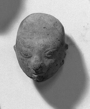 <em>Figure of Head, High Skull with Hole at Top</em>. Orange clay Brooklyn Museum, Bequest of Porter Hoagland, 60.50.1. Creative Commons-BY (Photo: Brooklyn Museum, 60.50.1_acetate_bw.jpg)