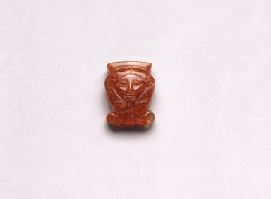  <em>Amulet in Form of Hathor Head Inscribed for Hatshepsut & Senenmut</em>, ca. 1478–1458 B.C.E. Carnelian, 13/16 x 11/16 x 1/4 in. (2.1 x 1.7 x 0.7 cm). Brooklyn Museum, Gift of John Hewett, 61.192. Creative Commons-BY (Photo: Brooklyn Museum, 61.192_SL1.jpg)