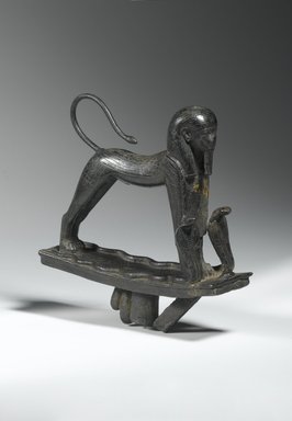  <em>Striding Sphinx</em>, ca. 945–712 B.C.E. Bronze, 5 1/2 x 1 5/8 x 5 in. (14 x 4.1 x 12.7 cm). Brooklyn Museum, Charles Edwin Wilbour Fund, 61.20. Creative Commons-BY (Photo: Brooklyn Museum, 61.20_threequarter_front_PS1.jpg)