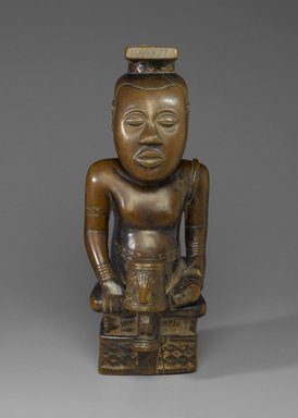 Kuba (Bushoong subgroup) artist. <em>Ndop figure depicting Nyim Mbó Mbóosh (r. ca. 1650), Nyim Mishé miShyááng máMbúl (r. ca. 1710), or Nyim Kot áNée (r. ca. 1740)</em>, ca. 1760-1780. Wood (Crossopteryx febrifuga), tukula, fiber, 19 1/2 × 8 × 10 in. (49.5 × 20.3 × 25.4 cm). Brooklyn Museum, Purchased with funds given by Mr. and Mrs. Alastair B. Martin, Mrs. Donald M. Oenslager, Mr. and Mrs. Robert E. Blum, and the Mrs. Florence A. Blum Fund, 61.33. Creative Commons-BY (Photo: Brooklyn Museum, 61.33_front_PS2.jpg)