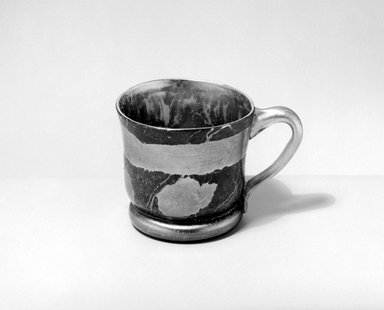 Tiffany Studios (1902–1932). <em>Mug</em>, ca. 1900. Opalescent glass, 3 1/8 x 5 x 3 5/8 in. (7.9 x 12.7 x 9.2 cm). Brooklyn Museum, Gift of Alfred M. F. Kiddle, 62.102.5. Creative Commons-BY (Photo: Brooklyn Museum, 62.102.5_bw.jpg)