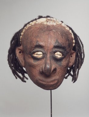 Iatmul. <em>Ancestral Skull</em>, early 20th century. Human skull, clay, pigment, cowrie shells, human hair, 8 1/2 x 7 1/2 x 9 1/4 in. (21.6 x 19.1 x 23.5 cm). Brooklyn Museum, Frank L. Babbott Fund, 62.18.1. Creative Commons-BY (Photo: Brooklyn Museum, 62.18.1.jpg)