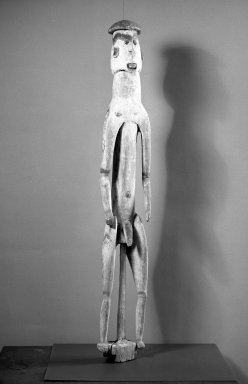 Asmat. <em>Male Figure (Kawe)</em>, 20th century. Wood, pigment, seed, 45 x 7 x 5 1/2 in. (114.3 x 17.8 x 14 cm). Brooklyn Museum, Gift of Stanley Ross, 62.55.14. Creative Commons-BY (Photo: Brooklyn Museum, 62.55.14_acetate_bw.jpg)