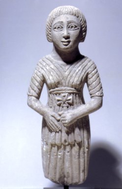  <em>Standing Woman</em>, 20th century (probably). Limestone, pigment, 16 9/16 x 6 1/16 x 3 11/16 in. (42.1 x 15.4 x 9.3 cm). Brooklyn Museum, Charles Edwin Wilbour Fund, 63.36. Creative Commons-BY (Photo: Brooklyn Museum, 63.36_front.jpg)