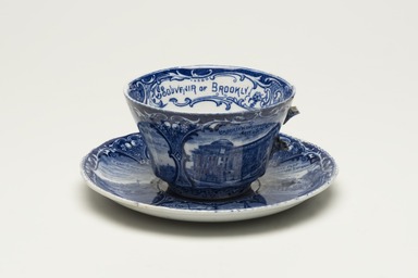The Rowland & Marsellus Company (1893-1938). <em>Cup and Saucer</em>, early 20th century. 
Glazed earthenware, Cup: 2 1/2 × 3 7/8 in. (6.4 × 9.8 cm). Brooklyn Museum, Gift of Charles W. Hancock, 63.91a-b. Creative Commons-BY (Photo: Brooklyn Museum, 63.91a-b_view01_PS11.jpg)