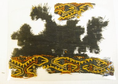 Paracas Ocucaje. <em>Textile Fragment, unascertainable, Border</em>, 800 B.C.E.-600 C.E. Cotton, camelid fiber, 2 3/4 x 5 1/8 in. (7.0 x 13.0 cm). Brooklyn Museum, Gift of Adelaide Goan, 64.114.187 (Photo: Brooklyn Museum, 64.114.187_front_PS5.jpg)