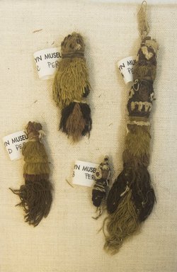 Chimú. <em>4 Textile Fragments, Undetermined or Mantle?, Tassels, 4 Fragments</em>, 1000-1400. Cotton, camelid fiber, a. 18.0 x 14.0 cm. Brooklyn Museum, Gift of Adelaide Goan, 64.114.64a-d (Photo: Brooklyn Museum, 64.114.64a-d_front_PS5.jpg)