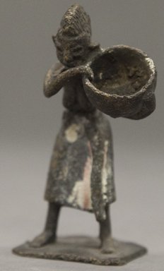 Fon. <em>Figure of Standing Female Carrying Bowl</em>, 19th century. Copper alloy, (height: 8.4 cm). Brooklyn Museum, Gift of Clara S. Peck, 64.212.2. Creative Commons-BY (Photo: Brooklyn Museum, 64.212.2_PS10.jpg)