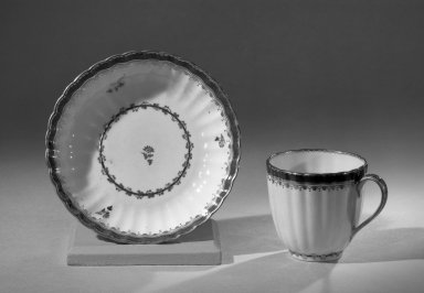 Derby Porcelain Factory (1750-present). <em>Coffee Cup and Saucer, from Set</em>, ca. 1795-1796. Porcelain, cup: 2 1/2 x 2 5/8 in. (6.4 x 6.7 cm). Brooklyn Museum, Anonymous gift, 64.241.44. Creative Commons-BY (Photo: Brooklyn Museum, 64.241.44_acetate_bw.jpg)