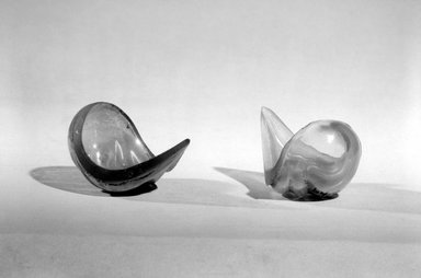 Tiffany Studios (1902-1932). <em>Pair of Salts</em>, ca. 1900. Glass, (a): 1 5/8 x 2 3/4 x 1 7/8 in. (4.1 x 7 x 4.8 cm). Brooklyn Museum, Gift of Mrs. Anthony Tamburro in memory of her father, Rene de Quelin
, 64.246.3a-b. Creative Commons-BY (Photo: Brooklyn Museum, 64.246.3a-b_acetate_bw.jpg)