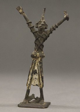 Fon. <em>Figure of a Man with Upraised Arms</em>, late 19th or early 20th century. Copper alloy, 12 1/4 x 6 1/2 in. Brooklyn Museum, Gift of Clara S. Peck, 64.49. Creative Commons-BY (Photo: Brooklyn Museum, 64.49_PS10.jpg)