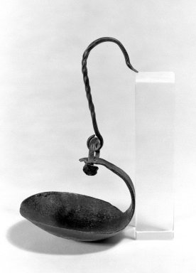 American. <em>Grease Lamp</em>, ca.1800. Wrought iron, 6 3/4 x 3 1/2 in. (17.1 x 8.9 cm). Brooklyn Museum, Gift of Mr. and Mrs. Henry Sherman, 67.128.33. Creative Commons-BY (Photo: Brooklyn Museum, 67.128.33_bw.jpg)
