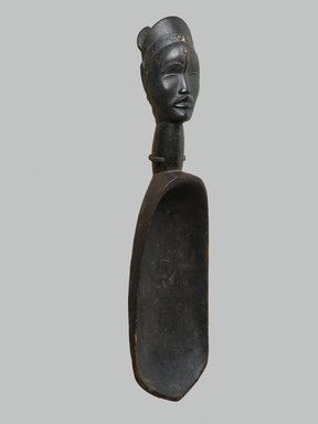 Dan. <em>Feast Ladle (Wunkermian)</em>, late 19th–early 20th century. Wood, metal, 22 7/16 x 5 3/8 x 6 1/2 in. (57 x 13.7 x 16.5 cm). Brooklyn Museum, Gift of Mr. and Mrs. Arthur Wiesenberger, 67.209.1. Creative Commons-BY (Photo: Brooklyn Museum, 67.209.1_threequarter_PS2.jpg)