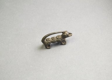 Akan. <em>Gold-weight (abrammuo): animal</em>. Brass, 13/16 x 3/8 x 1 11/16 in. (2 x 1 x 4.3 cm). Brooklyn Museum, Bequest of Laura L. Barnes, 67.25.10. Creative Commons-BY (Photo: Brooklyn Museum, 67.25.10_side_PS5.jpg)