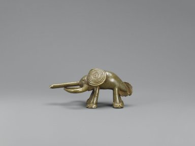 Akan. <em>Gold-weight (abrammuo): elephant</em>, 19th or 20th century. Brass, 1 11/16 x 3 3/4 in. (4.3 x 9.5 cm). Brooklyn Museum, Bequest of Laura L. Barnes, 67.25.15. Creative Commons-BY (Photo: Brooklyn Museum, 67.25.15_PS6.jpg)