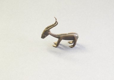 Akan. <em>Gold-weight (abrammuo): gazelle</em>. Brass, 2 1/16 x 5/16 x 1 15/16 in. (5.2 x 0.8 x 5 cm). Brooklyn Museum, Bequest of Laura L. Barnes, 67.25.9. Creative Commons-BY (Photo: Brooklyn Museum, 67.25.9_side_PS5.jpg)