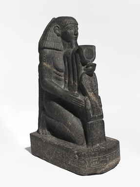  <em>Senenmut</em>, ca. 1478–1458 B.C.E. Granodiorite with granite vein, 18 3/4 × 7 × 11 1/2 in., 67.5 lb. (47.6 × 17.8 × 29.2 cm, 30.62kg). Brooklyn Museum, Charles Edwin Wilbour Fund, 67.68. Creative Commons-BY (Photo: , 67.68_threequarter_left_PS9.jpg)