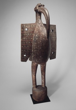 Senufo. <em>Figure of a Hornbill  (Kporopyan)</em>, early 20th century. Wood, paint, oil, 68 1/16 x 28 x 22 1/2 in.  (172.9 x 71.1 x 57.2 cm). Brooklyn Museum, Gift of Rosemary and George Lois, 68.159.1. Creative Commons-BY (Photo: Brooklyn Museum, 68.159.1_edited.jpg)