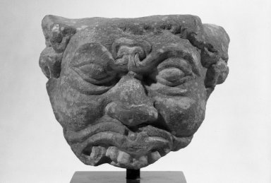  <em>Fragment of a Demon? Head</em>, ca. 2nd-3rd century. Carved sandstone, 4 1/8 x 5 1/2 x 3 1/2 in. (10.5 x 14 x 8.9 cm). Brooklyn Museum, Gift of Mr. and Mrs. Paul E. Manheim, 68.206.1. Creative Commons-BY (Photo: Brooklyn Museum, 68.206.1_acetate_bw.jpg)